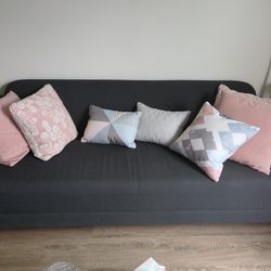 Muted Blue Sofa With Decor Pillows