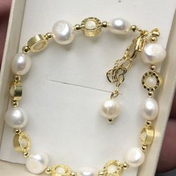 36ct  Baroque Freshwater White colored 10, 6.5mm Pearls and beads make this simple but elegant bracelet at 6-8 inches with great luster