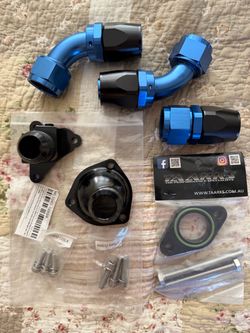 Brand new Taarks SR20 16AN thermostat housing, water neck outlet, & water pump spacers  billet adapters plus custom blue and black 16AN fittings