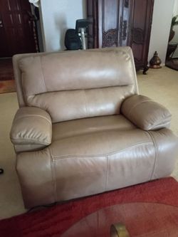 A beige large recliner