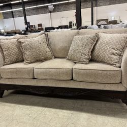 Emma wheat Sofa With Elegant hand carved wood trim!