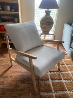 Cream and natural wood accent lounge chair
