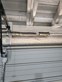 Overhead garage door broken spring opener off track adjustment replace and parts