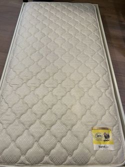 White Pottery Barn trundle bed with Serta mattress