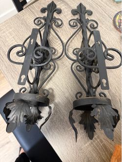 Two Amber Glass Wall Sconces with Black Wall Mounts