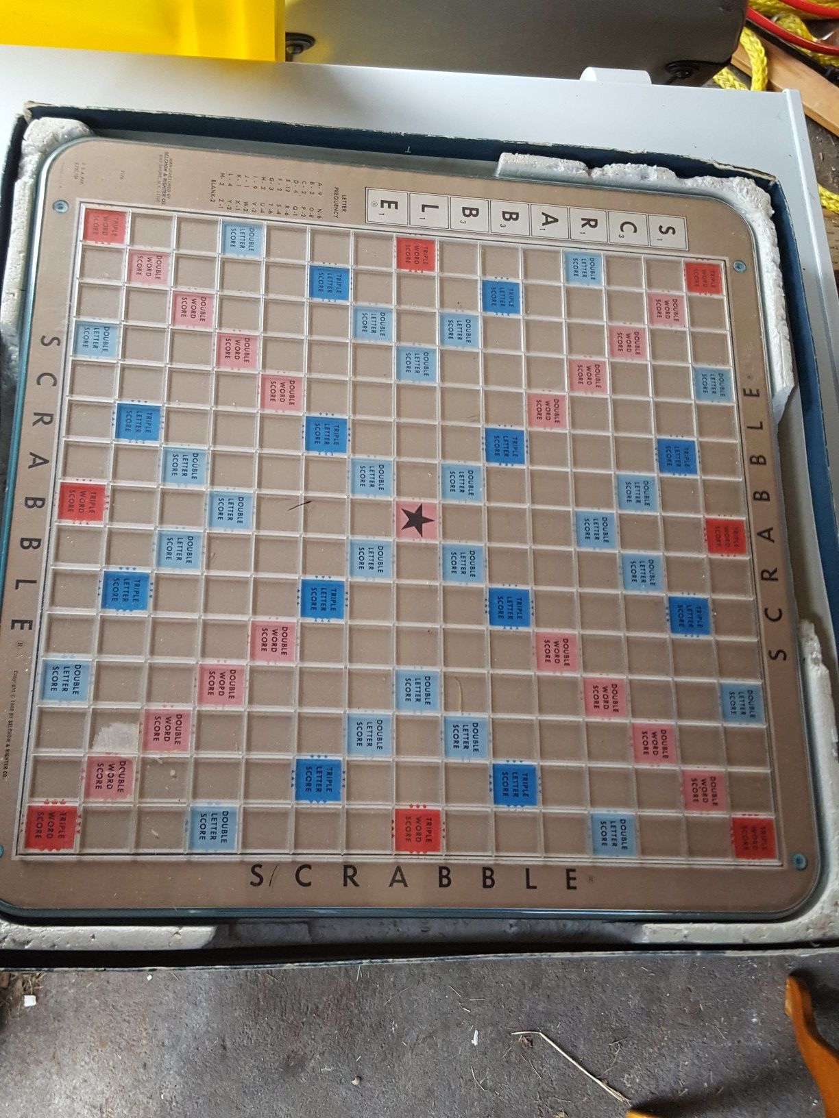 Scrabble swivel board game with paper back scrabble book