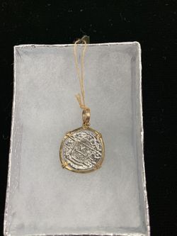 Atocha silver coin with gold bezel