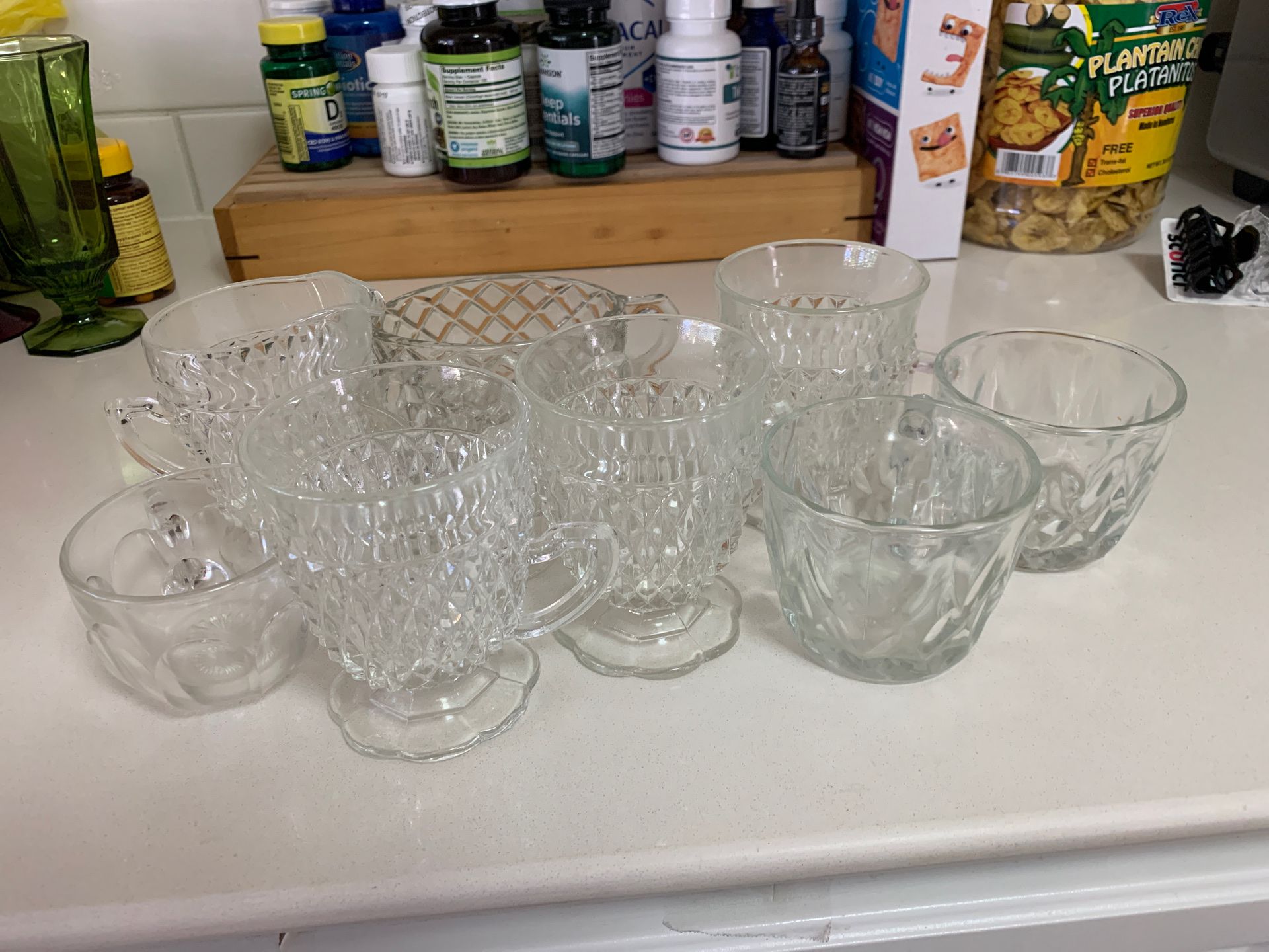 Antique glasses and cups with creamer and sugar served