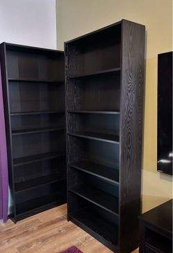 Dark brown bookshelf and entertainment center