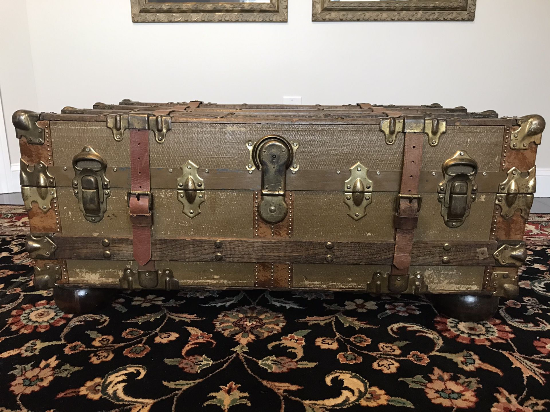 Antique Vintage Steamer Trunk with heavy glass top and optional hardwood bun feet for use as a coffee table.