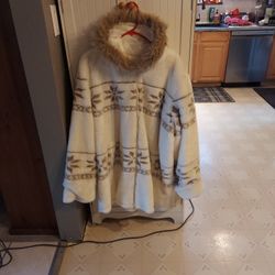 Fur coat with hood reversible to raincoat