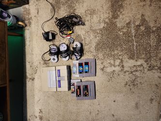 Super Nintendo System With Games And 3 Remotes