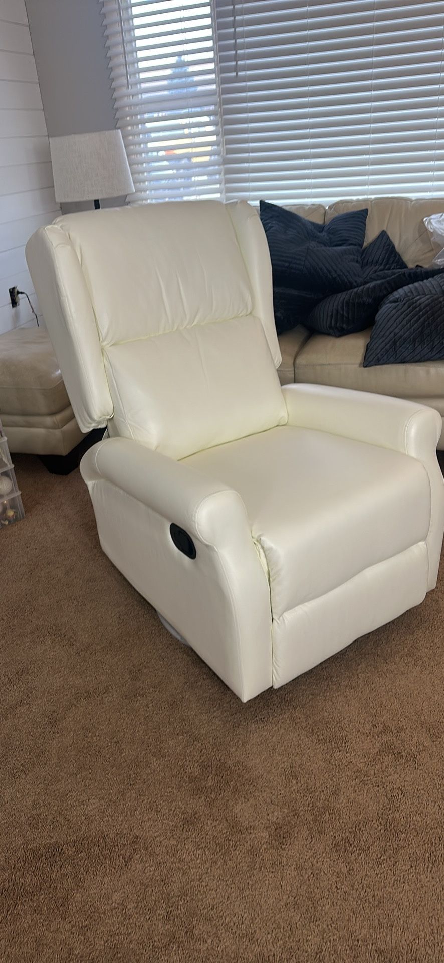 White recliner. Swivel