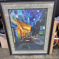 Large print and frame of Vincent van Gogh's famous painting, "Café Terrace at Night