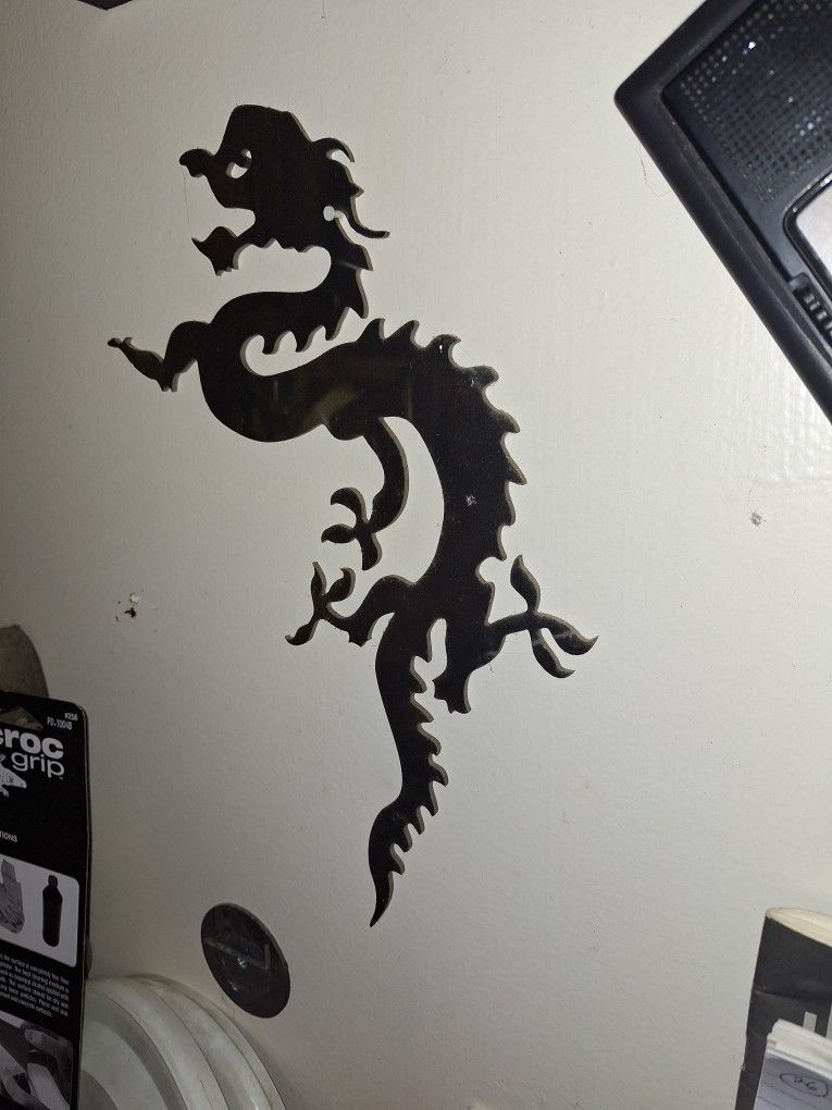 Chrome metal dragon cutout.
30 bucks Or best Offer.