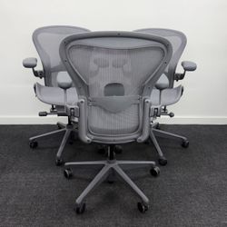 HERMAN MILLER REMASTERED AERON SIZE B LIKE NEW CARBON FINISH  WITH ADJUSTABLE ARM & ADJUSTABLE LUMBAR $799 EACH 