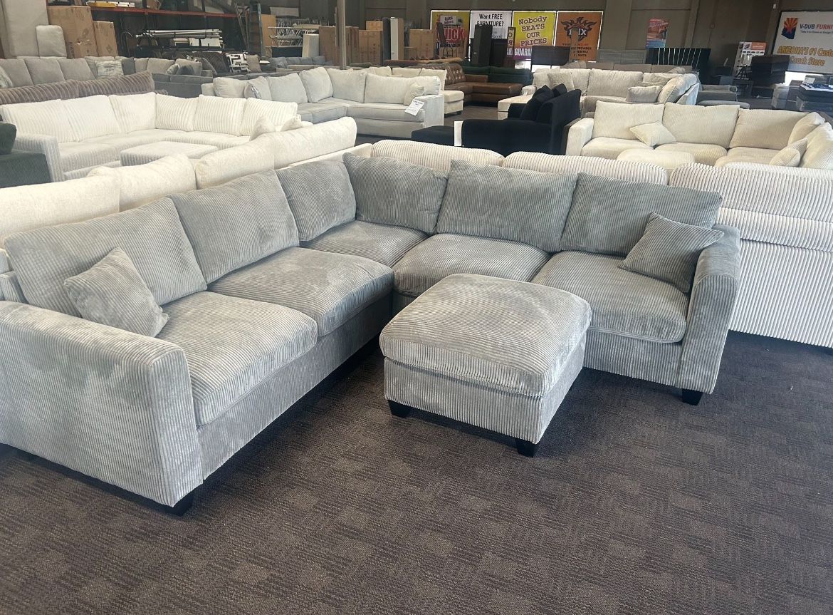 New Grey Sectional And Ottoman