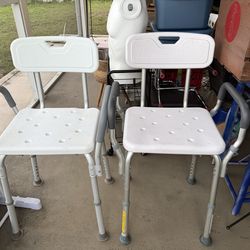 Set of two near new shower chairs
