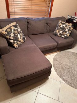 Brown L shaped couch