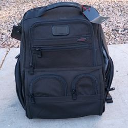 TUMI Alpha 3 Compact Laptop Brief Pack, a business backpack known for its durability and organization. 