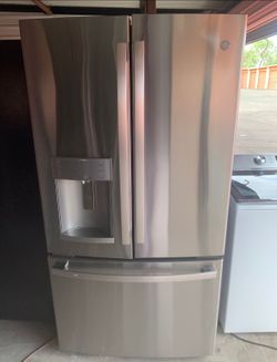 GE Stainless Steel Refrigerator And Freezer