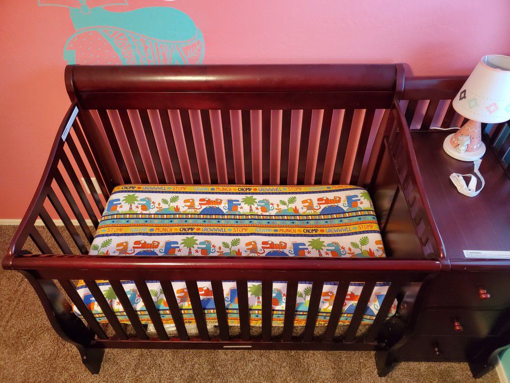 Crib with attached changing table
