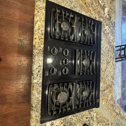Black Kenmore 36 Gas Stove with Down draft hood