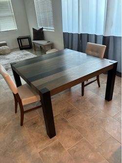 Wooden table and two chairs