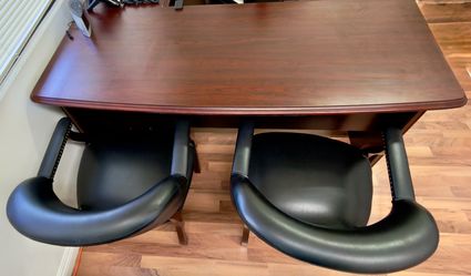 Executive desk and chairs.