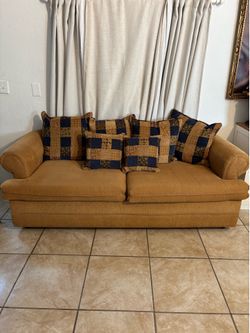Beige Loveseat Couch with Decorative Pillows