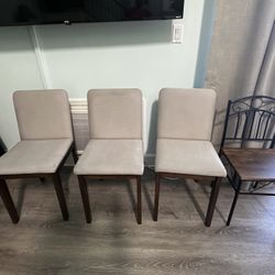 Four Dining Chairs , Three Of Them Upholstered And Made Of Wood