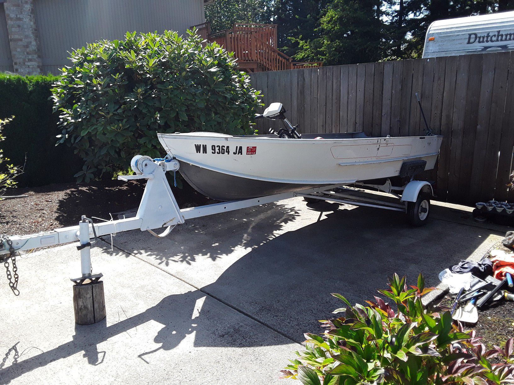 12 foot aluminum boat with a trolling motor and a 35hp motor