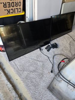 2 LG monitors with remotes, mounting  rack. And security device