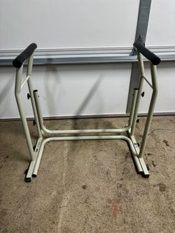 Toilet safety frame with handles