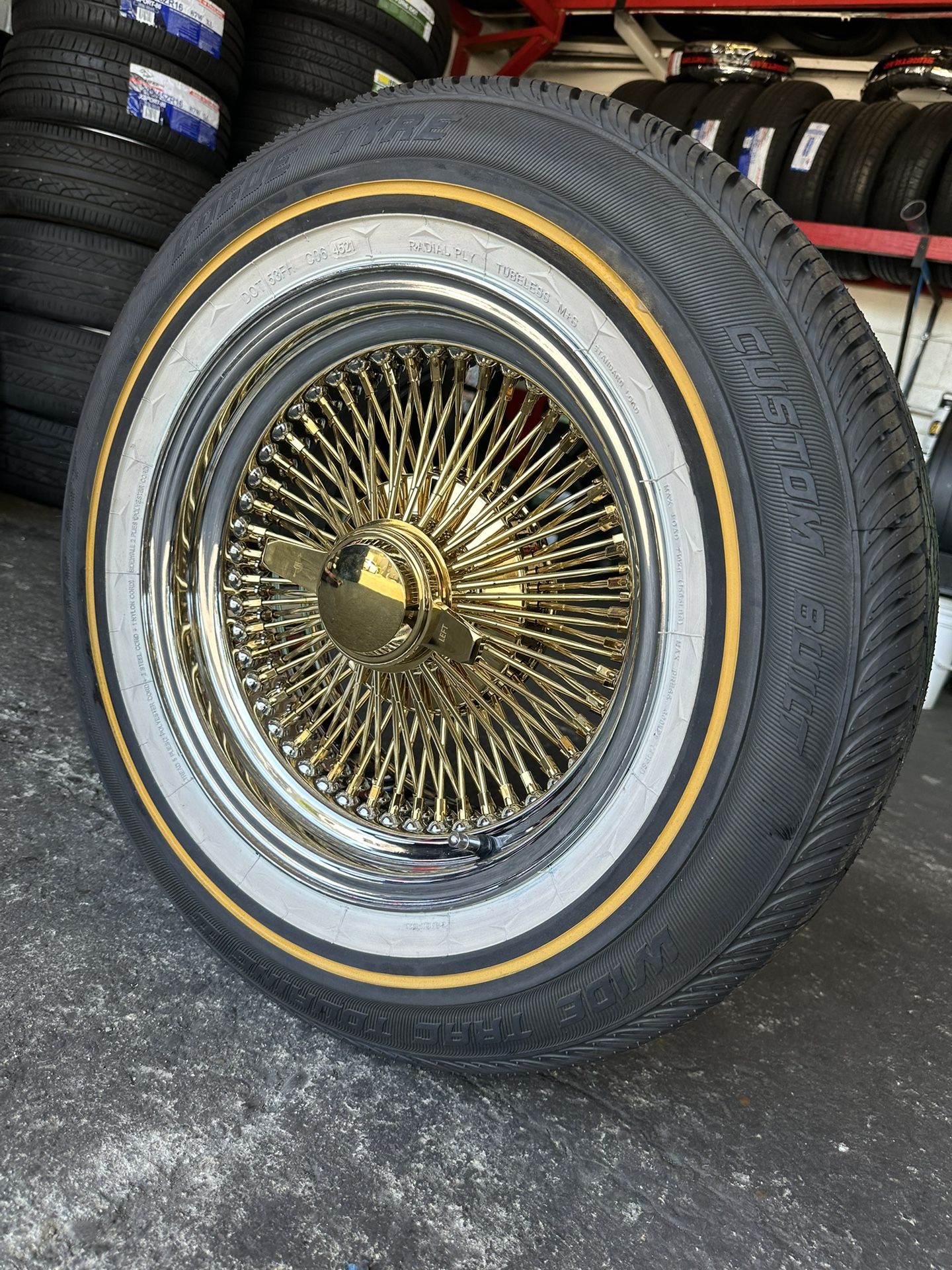 Brand new wire wheels 15x7 gold 100 spokes with 215/65R15 Vogue tires available with installation we finance