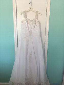 Wedding dress used once size 14 ( stains at the bottom )