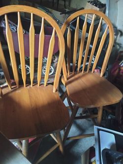 2 solid oak swivel chairs