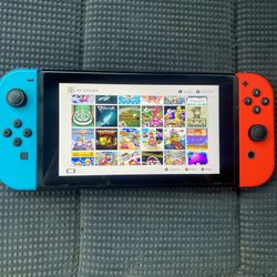 NINTENDO SWITCH V2 + 120 SWITCH GAMES MARIO PARTY,MARIO KART,POKEMON,SELDA,MINECRAFT and More
