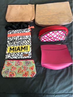 Elizabeth Arden, and Lancome purses