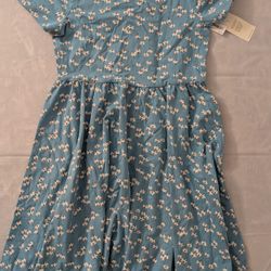 Tea, light blue floral print short-sleeved dress with a criss-cross back detail.size 10 girls