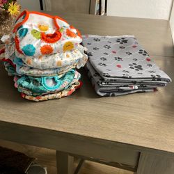 Nine pairs of washable doggy diapers size large, two medium three new washable pads