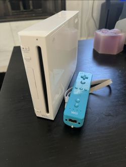 Wii with blue remote and all cords