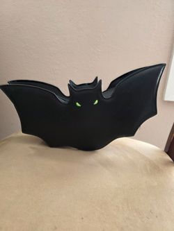 Bat purse with strap.