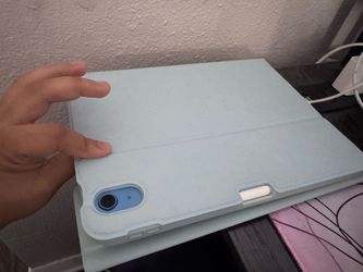 Blue iPad 10th generation with Apple Pencil and case with keyboard