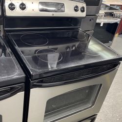 Used GE 4 Burner Glass Top Black And Stainless Steel Range. 1 Year Warranty 