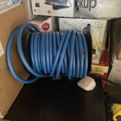 Brand New 100 Foot Hose And Reels 