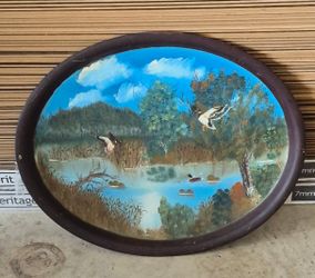 metal plate with painting on it