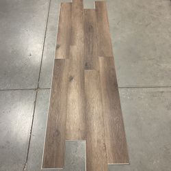 Waterproof vinyl plank flooring w/pad attached “click” @ 3. 29