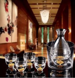 Elegant glass decanter with 4 matching whiskey glasses