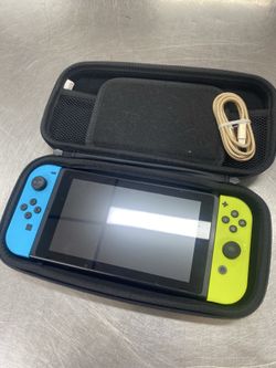 Nintendo Switch with charging cord hard carrying case